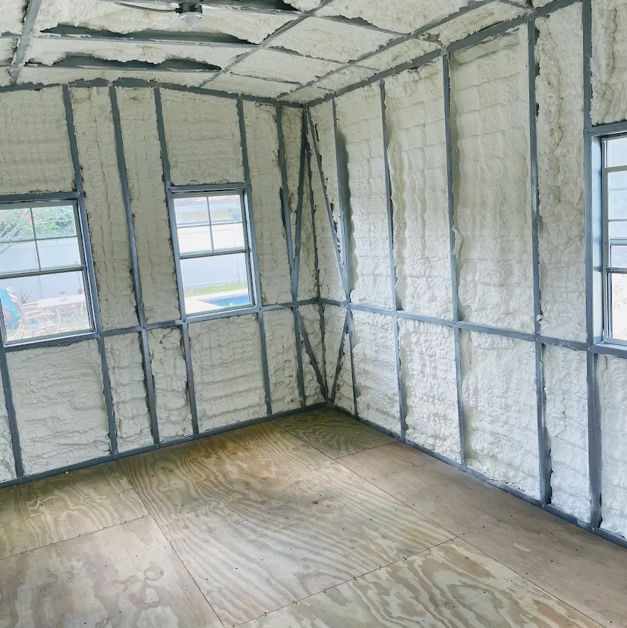 Closed-cell spray foam insulation applied to wall cavities in a residential project in Hutchins